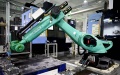 A robot processes hydraulic motors at the intelligent manufacturing industrial park of Eddie Precision Machinery Co., Ltd. in Yantai, east China's Shandong Province. Photo by Xinhua/Guo Xulei.