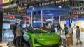 Visitors watch a new-energy car displayed by FAW Hongqi during the China-Northeast Asia Expo in Changchun, northeast China's Jilin Province. Photo by Xinhua/Zhang Nan.