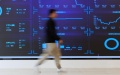 A staff member walks past a screen at the State Key Laboratory of Public Big Data at Guizhou University in Guiyang, southwest China's Guizhou Province. Photo by Xinhua/Liu Xu.