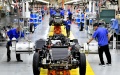 Workers assemble automobiles at the production line of Weichai New Energy Commercial Vehicle Co., Ltd. in Wendeng District of Weihai City, east China's Shandong Province. Photo by Xinhua/Guo Xulei.