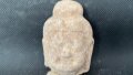 A stone Buddhist head unearthed at an ancient Buddhist temple dating back to the Northern Wei Dynasty (386-534) in Pingcheng District, Datong, north China's Shanxi Province. Photo by Xinhua.