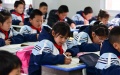 Students have a class in a prefabricated classroom in Guanting Town, Minhe Hui and Tu Autonomous County, northwest China's Qinghai Province. Photo by Xinhua/Zhang Long.