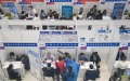 Students attend a job fair in Tsinghua University in Beijing. Photo by Xinhua/Ju Huanzong.