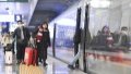Passengers get aboard on a train at Shapingba Railway Station in southwest China's Chongqing.  Photo by Xinhua/Wang Quanchao.