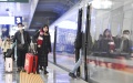 Passengers get aboard on a train at Shapingba Railway Station in southwest China's Chongqing.  Photo by Xinhua/Wang Quanchao.