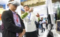 A visitor learns about a VR device during an exhibition of the China Internet Audio and Video Convention in Chengdu, southwest China's Sichuan Province. Photo by Xinhua/Tang Wenhao.