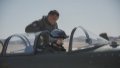 A flight instructor from Naval Aviation University guides a member of the first group of female pilot trainees from the carrier-based aircraft of the Chinese People's Liberation Army Navy in China. Photo by Chen Chao/Xinhua.
