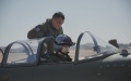 A flight instructor from Naval Aviation University guides a member of the first group of female pilot trainees from the carrier-based aircraft of the Chinese People's Liberation Army Navy in China. Photo by Chen Chao/Xinhua.