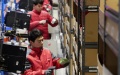 Staff members work at a Jingdong logistics center in Zhengzhou, central China's Henan Province. Photo by Xinhua/Li Jianan.