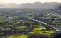 A passenger train running along the Xi'an-Chengdu high-speed railway in Yangchun Town of Nanzheng District in Hanzhong, northwest China's Shaanxi Province. Photo by Xinhua/Shao Rui.