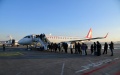 Passengers board a flight from Dalian to Japan's Kitakyushu at Dalian International Airport in Dalian, northeast China's Liaoning Province. Photo by Dalian International Airport/Xinhua.