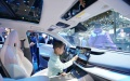 A child experiences a Lynk & Co's new energy vehicle at the 2024 Beijing International Automotive Exhibition in Beijing. Photo by Xinhua/Zhang Chenlin.