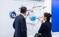Visitors look at an exhibit during the second International Summit on BeiDou Navigation Satellite System (BDS) Applications in Zhuzhou, central China's Hunan Province. Photo by Xinhua/Chen Sihan.
