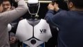 Researchers adjust a humanoid robot at an AI laboratory. Photo by Xinhua/Jin Liwang.