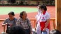 A staff member of Red Cross Society of China (RCSC) talks with residents at a temporary shelter in Shulan No.3 Middle School in Shulan City, northeast China's Jilin Province. Photo by Xinhua/Yan Linyun.