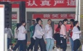 Examinees file into an exam site in Nanjing, east China's Jiangsu Province. Photo by Xinhua/Li Bo.