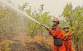 Firefighters operate at the site of a forest fire in Jinning District of Kunming, southwest China's Yunnan Province. Photo by Xinhua.