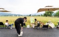 A customer takes a photo in the outdoor area of a village cafe in Doumu township of the city of Anqing, east China's Anhui province. Photo by Xinhua.