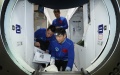 Chinese astronauts Nie Haisheng, Liu Boming and Tang Hongbo are seen during training. Photo by Xu Bu/Xinhua.