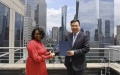 President of Xinhua News Agency Fu Hua and Daisy Veerasingham, president and CEO of the Associated Press (AP), exchange signed copy of cooperation agreement in New York, the United States. Photo by Xinhua/Li Rui.