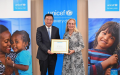 Fu and Van der Heijden signed a Memorandum of Understanding (MoU) between UNICEF and Xinhua News Agency. Photo by Xinhua/Li Rui.