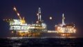 A full moon is seen over an oil production platform in Bohai Oilfield. Photo by Du Penghui/Xinhua.