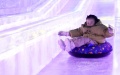 A kid enjoys an ice slide at an ice and snow art gallery of the Sun Island scenic spot in Harbin, northeast China's Heilongjiang Province. Photo by Xinhua/Wang Jianwei.