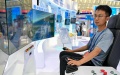 A staff member operates a simulator of a 5G-powered tower crane at the booth of China Construction Third Engineering Bureau Group at the 8th China-Eurasia Expo in Urumqi, northwest China's Xinjiang Uygur Autonomous Region. Photo by Xinhua/Ding Lei.