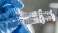A staff member displays samples of the COVID-19 vaccine at Sinovac Biotech Ltd, in Beijing, capital of China. Photo by Xinhua.