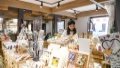 A tourist shops for cultural and creative products at a shop in Shancheng Alley in Yuzhong District, southwest China's Chongqing Municipality. Photo by Xinhua/Wang Quanchao.
