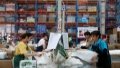Workers work at a warehouse in Longli County, southwest China's Guizhou Province. Photo by Yuan Fuhong/Xinhua.