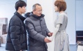 This photo provided by the interviewee shows professor Liu Xiaofeng talking with a graduate student on a humanoid robot at Hohai University in Nanjing, east China's Jiangsu Province. Photo by Xinhua.