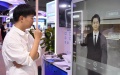 A staff member demonstrates his interaction with a virtual human during the Global Digital Economy Conference 2024 in Beijing, capital of China. Photo by Xinhua/Ren Chao.