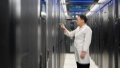 A staff member checks equipment at a data center of China Mobile in Horinger, Hohhot City, north China's Inner Mongolia. Photo by Xinhua/Li Zhipeng.