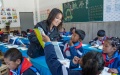 A volunteer teacher from Lingnan Normal University in Guangdong gives a lesson at the Central Primary School in Nyangpo Township, southwest China's Xizang Autonomous Region. Photo by Xinhua/Tenzin Nyida.