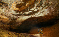 A member of Guizhou provincial mountain resources institute observes the rock formation inside a branch cave of Shuanghe Cave in Suiyang County, southwest China's Guizhou Province. Photo by Zhao Fei/Xinhua.