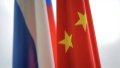 Flags of the aggressor country russia and China. Photo: depositphotos