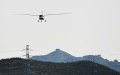 Electric aircraft RX1E-A makes maiden flight near Beijing's Badaling Great Wall. Photo by Xinhua.