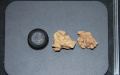 The comparison of a tube cap (L) and two Bronze Age cheese samples unearthed from a tomb site in northwest China's Xinjiang Uygur Autonomous Region. Photo by Yang Yimin/Xinhua.