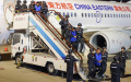 Criminal suspects are escorted by Chinese police officers at the Kunming Changshui International Airport in Kunming, southwest China's Yunnan Province. Photo by Xinhua/Yin Gang.