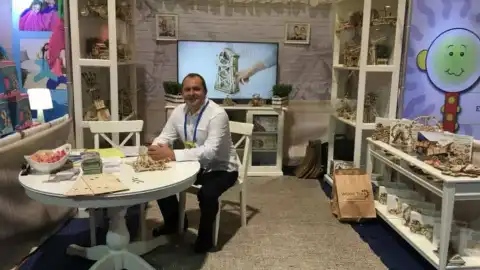 Dmytro Antonenko next to his inventions at the ABC Kids EXPO, Las Vegas, 2013