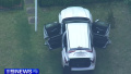 Man drives car through gates of russian consulate in Australia