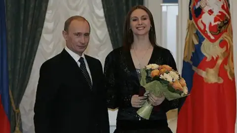 Владимир Путин и Светлана Захарова. Фото: Википедия