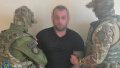 SSU detains a foreign hitman who, on the orders of the russian federation, tried to shoot a high-ranking officer of the Ukrainian Navy. Photo: SSU.