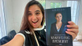 Yuliia Mendel with a book of her own. Photo: facebook/iuliia.mendel.2025