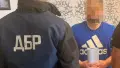 Затримання зловмисника. Фото: ДБР