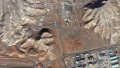 This satellite image shows a tunnel complex carved into rocky terrain near a built-up area in Isfahan, Iran. Photo: Maxar/DigitalGlobe.